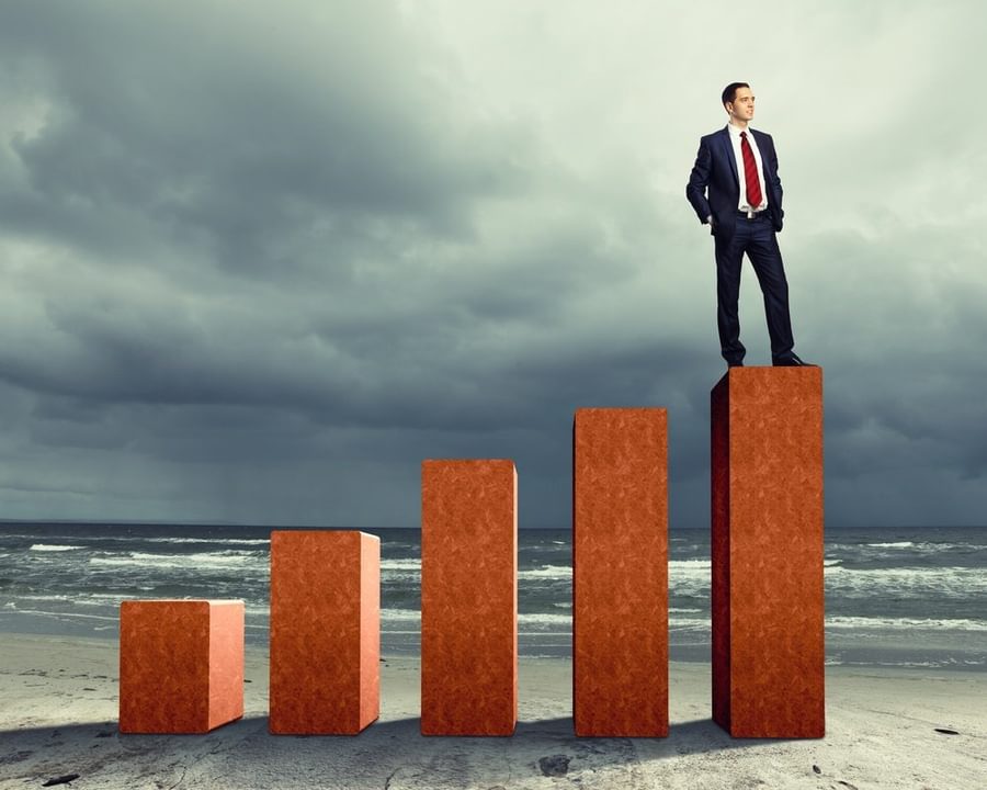 Business person on a graph representing success and growth