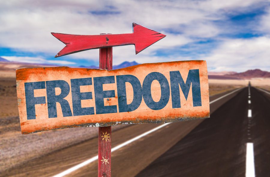 Freedom sign with road background