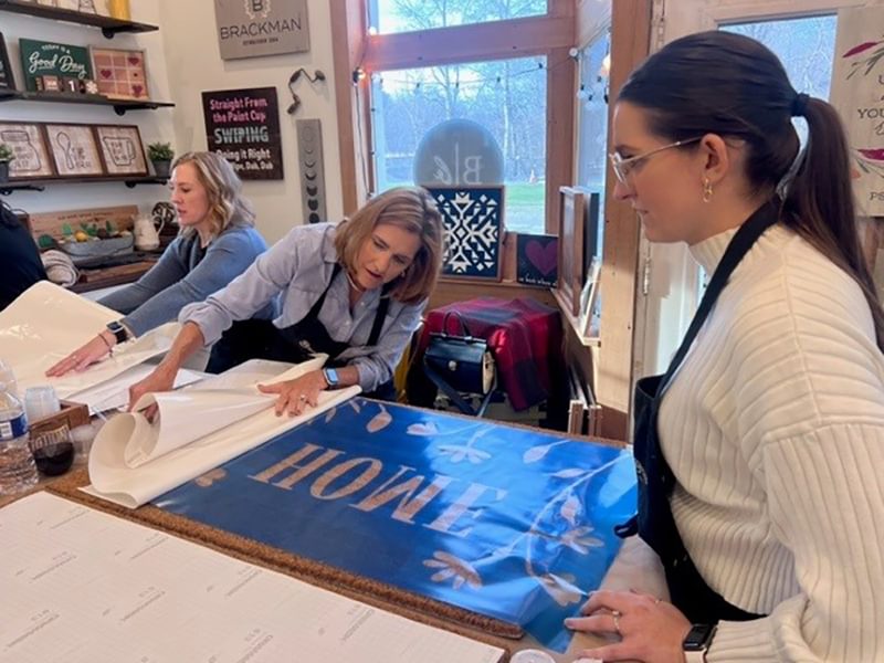 women working with stencil