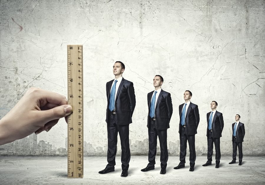 Successful confident businessmen standing in line Progress in career