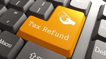 Tax Refund Orange Button on Computer Keyboard Internet Concept