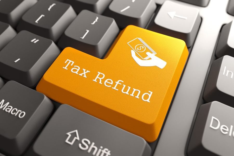 Tax Refund Orange Button on Computer Keyboard Internet Concept