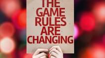 The Game Rules Are Changing card with colorful background with defocused lights