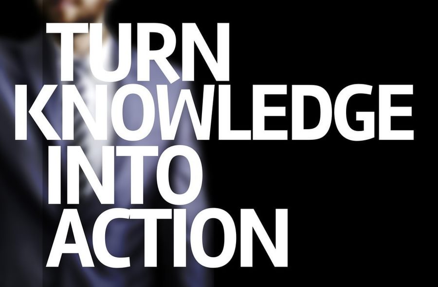 Turn Knowledge Into Action written on a board with a business man on background 1